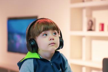 Small boy wearing headphones