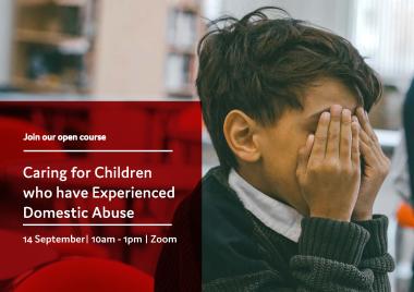 Boy covering his face with his hands