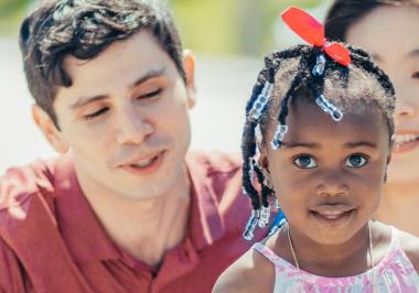 girl with red ribbon in her hair