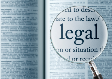 Magnifying glass highlighting the word 'legal'