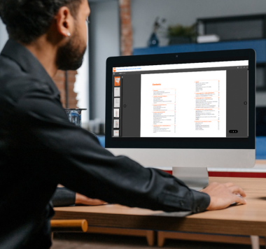 Man reading eBook at a desktop