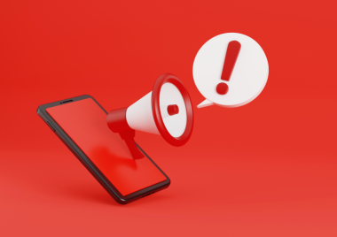 phone graphic with megaphone and warning bubble