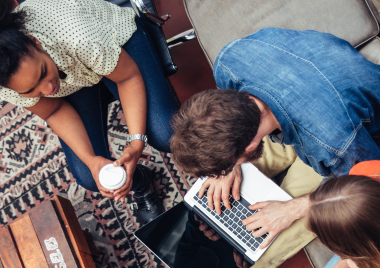 Three people coworking