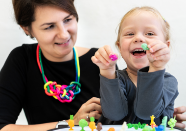 woman and child playing together