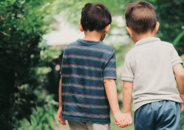 Two boys holding hands
