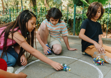 Children playing with marbles