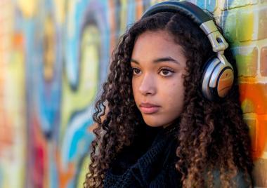 Teenage girl listening to music
