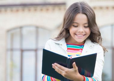 Girl writing in a notebook