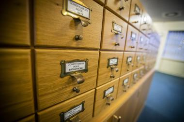 A wooden index card filing cabinet