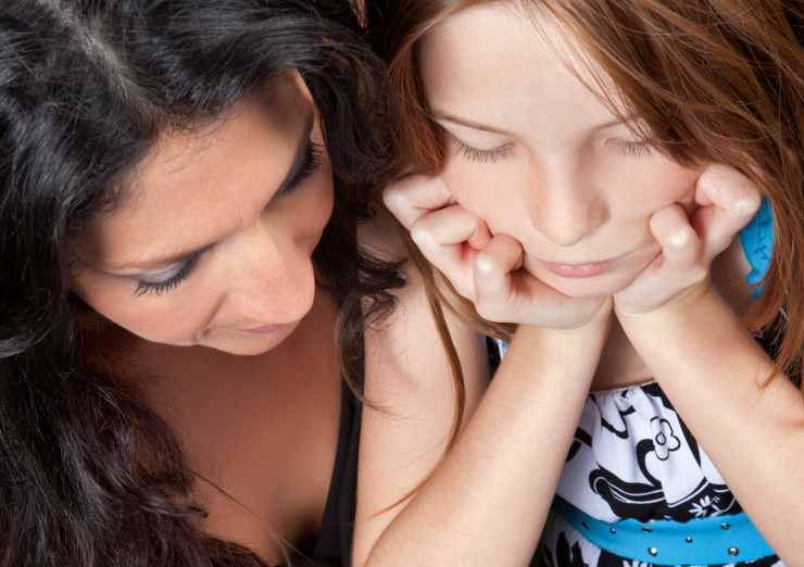 Adult and child completing a form