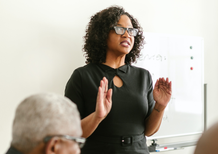 Woman standing and talking using her hands
